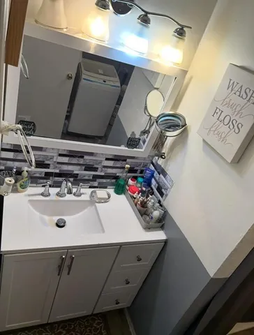 a view of a room with storage and utility room