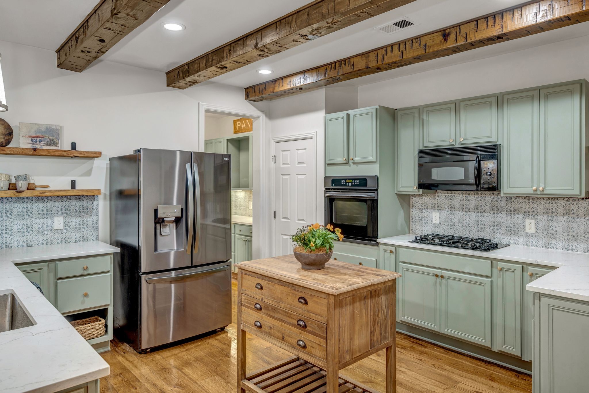 300 Addison Avenue Franklin, TN 37064 - Photo 11 of 35 a kitchen with stainless steel appliances a refrigerator a stove a sink and a microwave