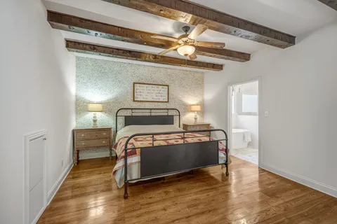 a bedroom with a bed and a dresser