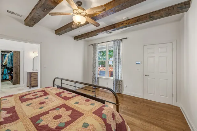 a bathroom with a bathtub sink and mirror