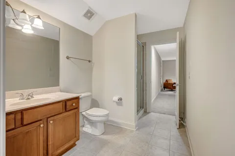 a view of a backyard with a tree