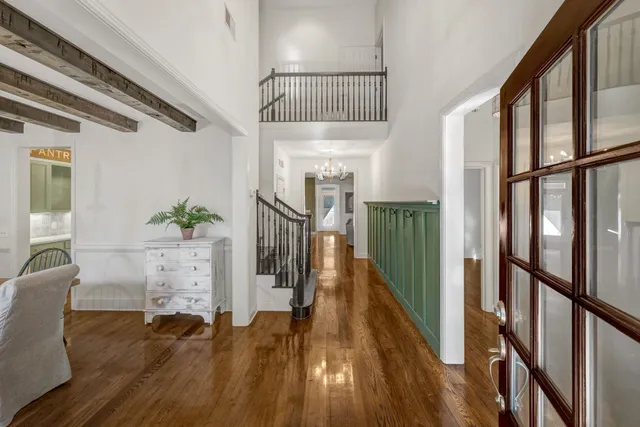 a view of entryway with wooden floor and stairs