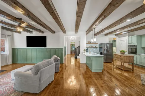 a kitchen with refrigerator and cabinets