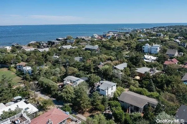 an aerial view of a house with a lake view