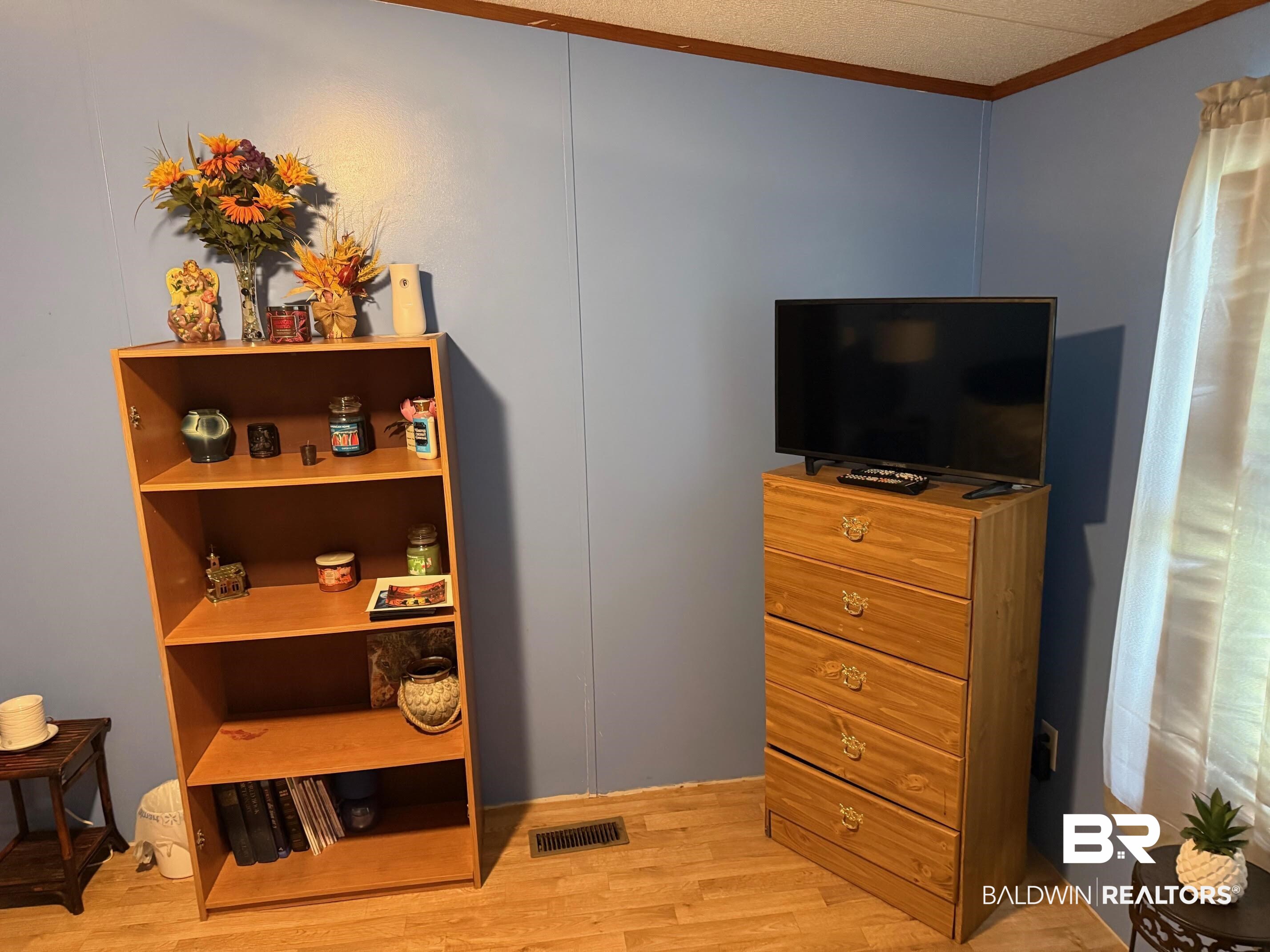 15844 County Road 87 Elberta, AL 36530 - Photo 21 of 28 Interior space with ornamental molding and light hardwood / wood-style flooring