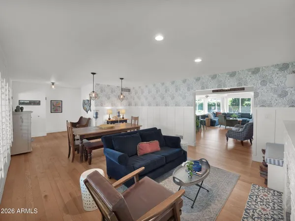 a kitchen with kitchen island granite countertop wooden cabinets stainless steel appliances and a counter space