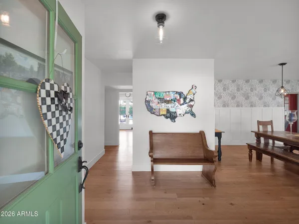 a living room with furniture a rug and a chandelier