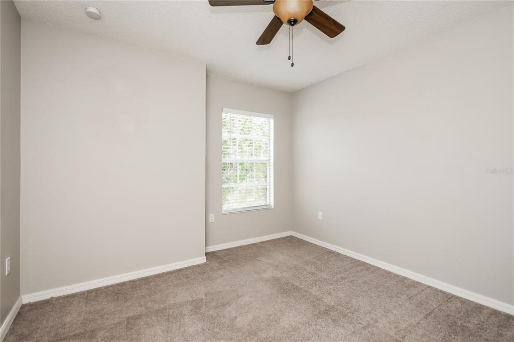 1170 Creekview Court St. Cloud, FL 34772 - Photo 12 of 17 an empty room with a window