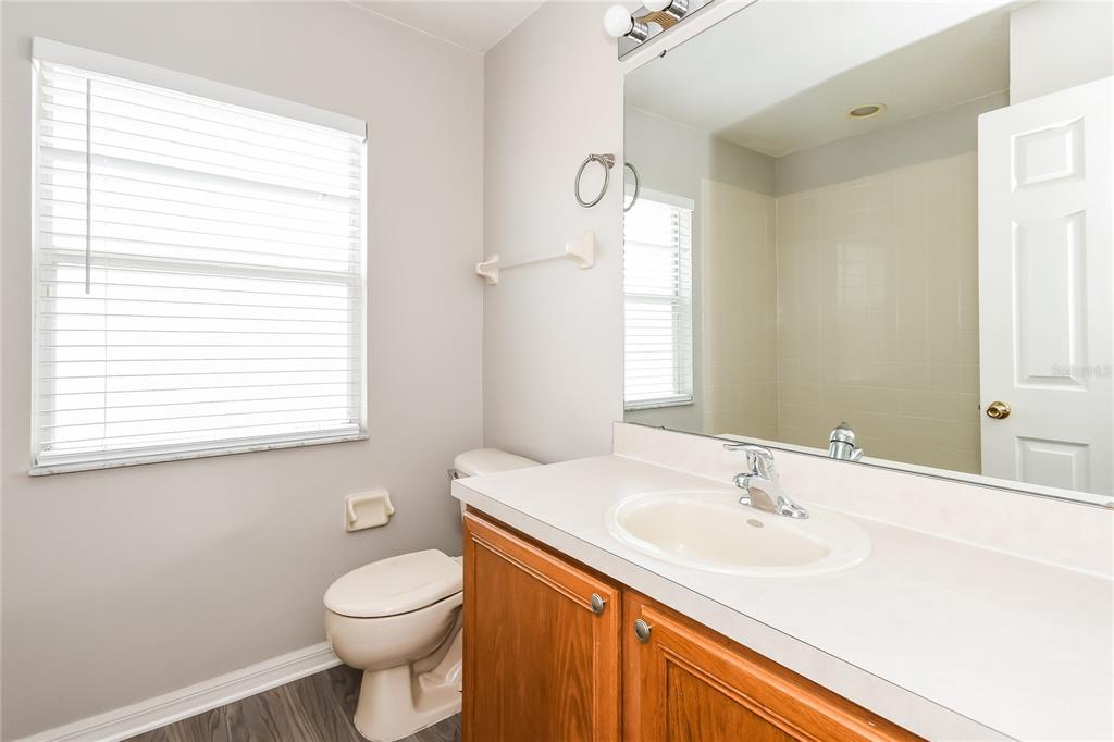 1170 Creekview Court St. Cloud, FL 34772 - Photo 14 of 17 a bathroom with a sink toilet and a mirror