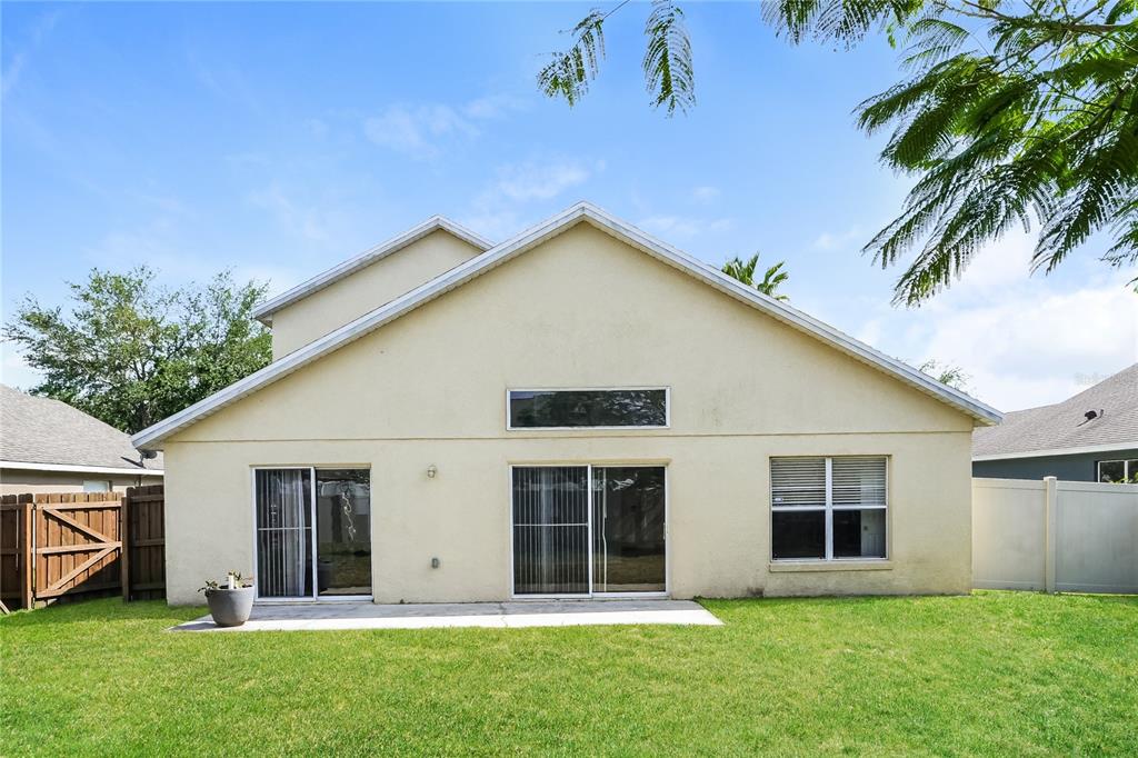 1170 Creekview Court St. Cloud, FL 34772 - Photo 15 of 17 a view of a house with a yard