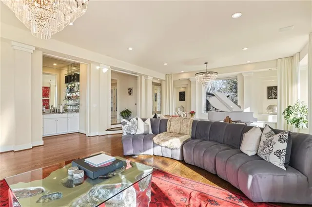 a kitchen with stainless steel appliances granite countertop a stove and a white cabinet