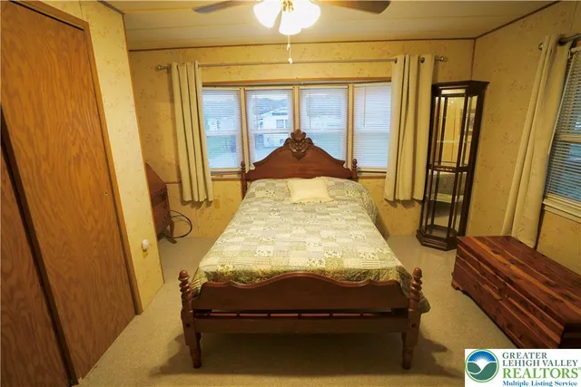 a room with bed and window