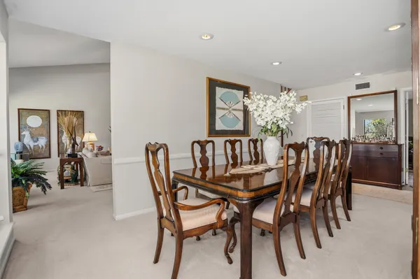a dining room with furniture and window