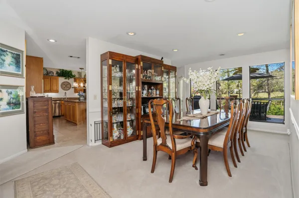 a dining room with furniture and window