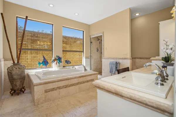 a en suite bathroom with sink and mirror