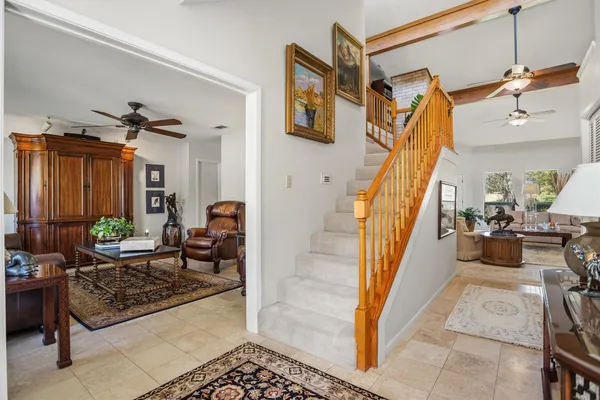 a living room with furniture and a rug