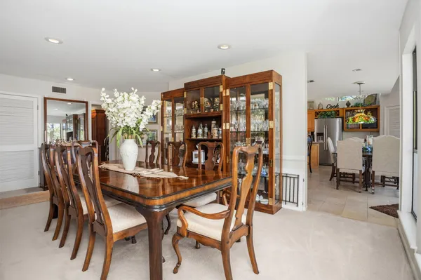 a dining room with furniture and window