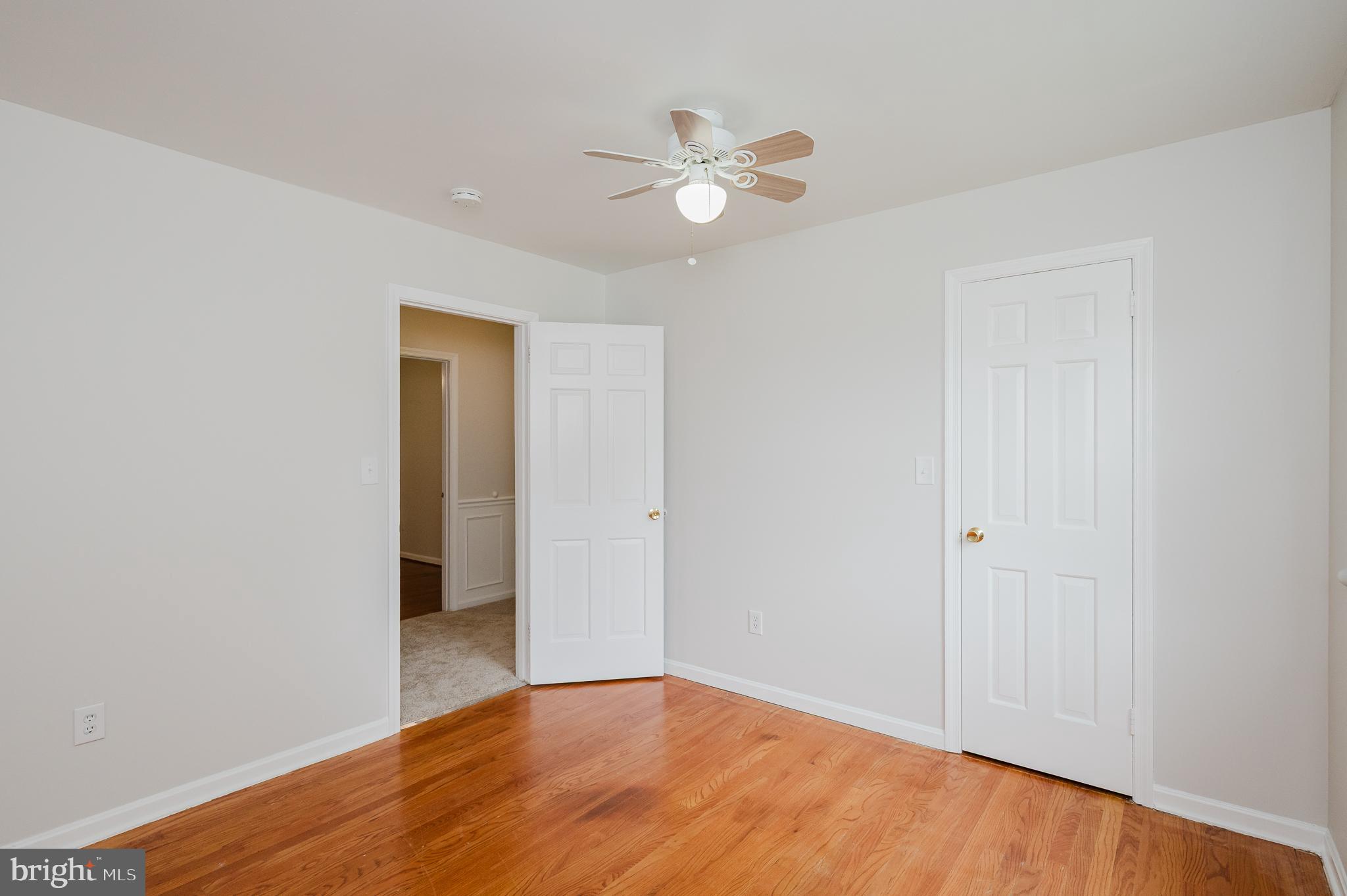 4 Old Spring Court Cockeysville, MD 21030 - Photo 45 of 53 a view of an empty room with wooden floor