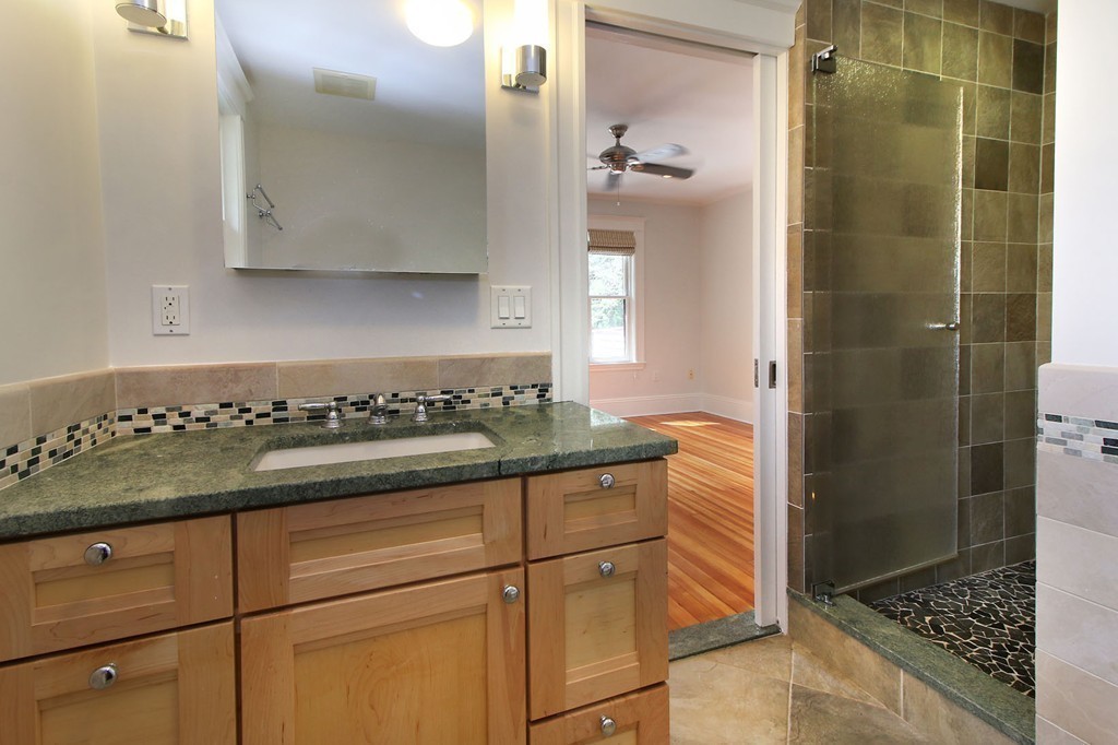 57 Winthrop Road, Unit 1 Brookline, MA 02445 - Photo 11 of 17 a kitchen with a granite countertop cabinets and a stove