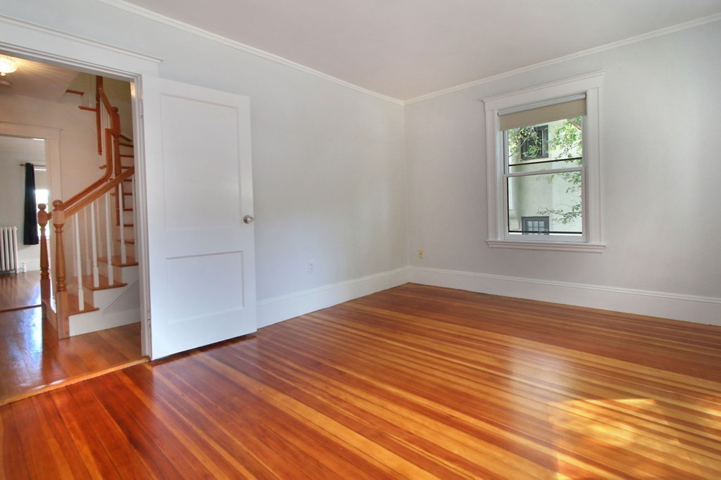 57 Winthrop Road, Unit 1 Brookline, MA 02445 - Photo 13 of 17 a view of empty room with wooden floor and fan