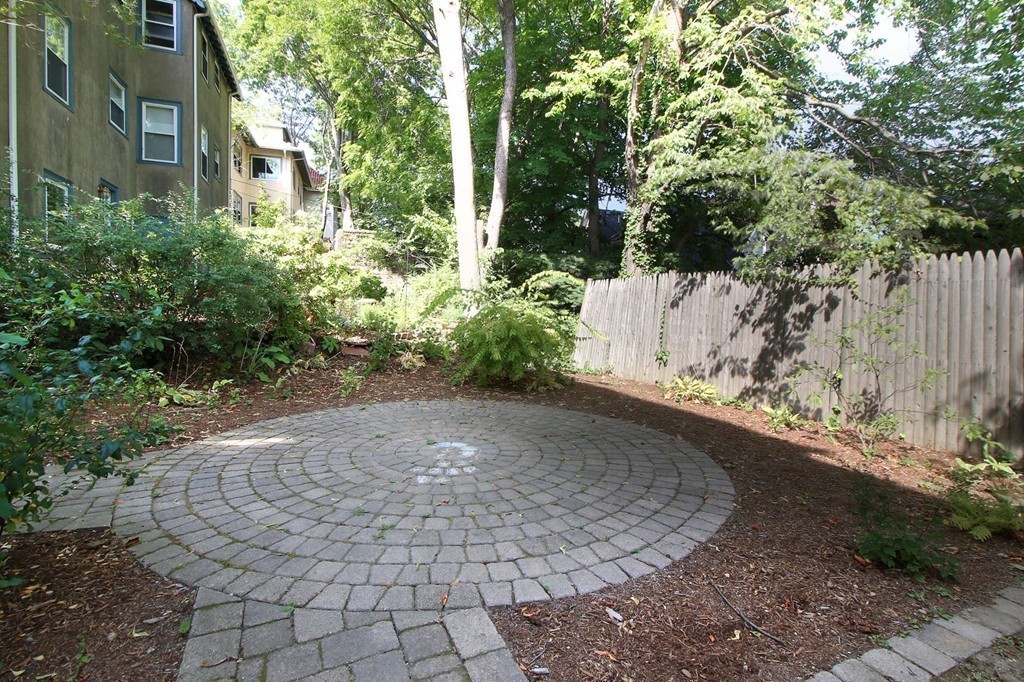 57 Winthrop Road, Unit 1 Brookline, MA 02445 - Photo 16 of 17 a view of a yard with plants and trees