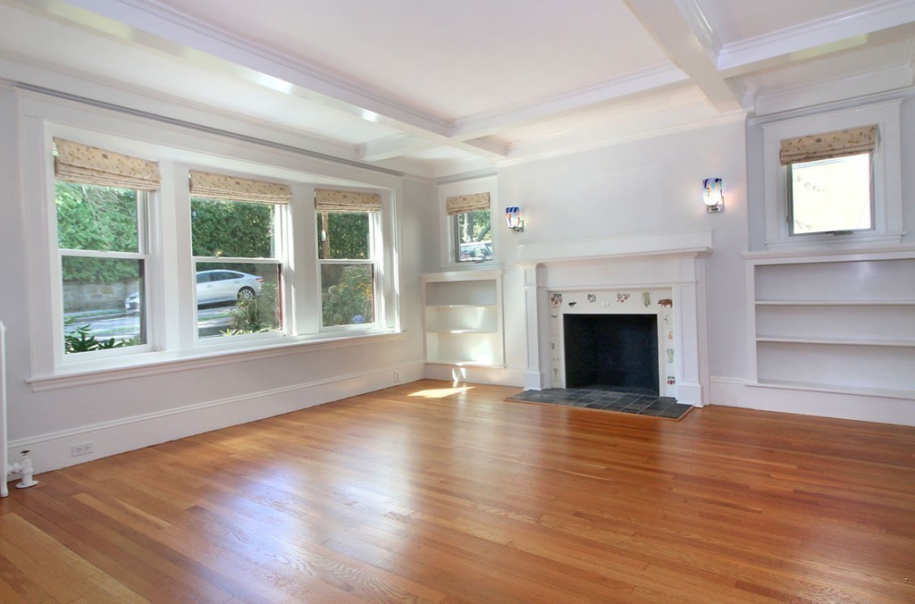 57 Winthrop Road, Unit 1 Brookline, MA 02445 - Photo 2 of 17 a view of an empty room with wooden floor and a window