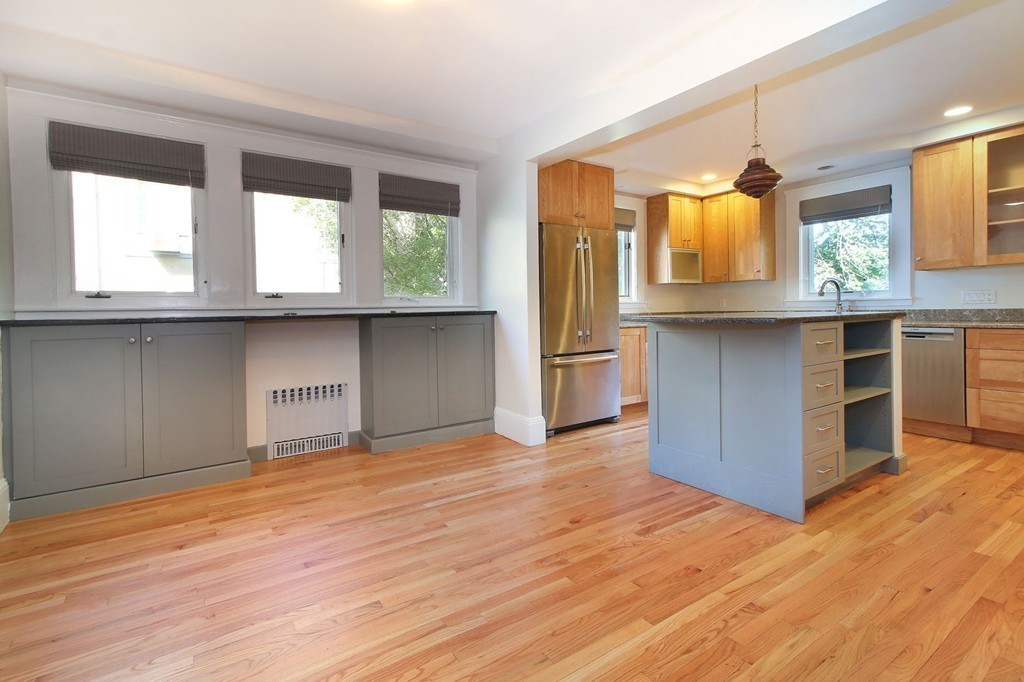 57 Winthrop Road, Unit 1 Brookline, MA 02445 - Photo 7 of 17 a kitchen with wooden floors and a window