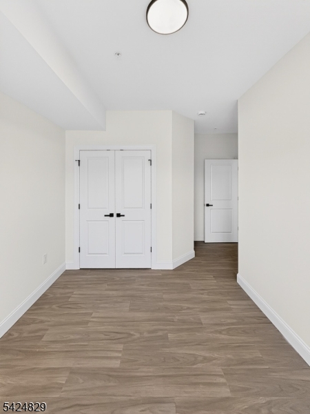 262 Hunterdon Street, Unit 1 Newark, NJ 07103 - Photo 12 of 31 a view of an empty room with wooden floor