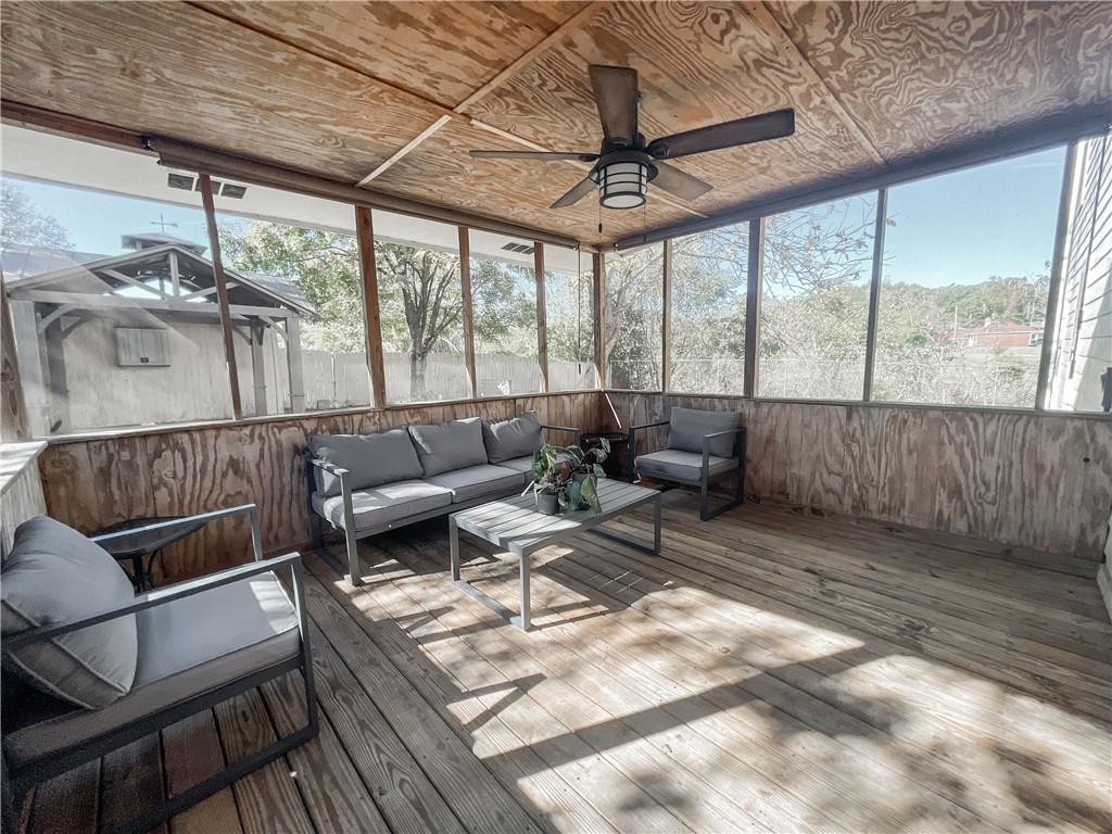 280 Mimosa Road Phenix City, AL 36870 - Photo 29 of 38 Sunroom featuring outdoor lounge area, a ceiling fan, and a wooden deck