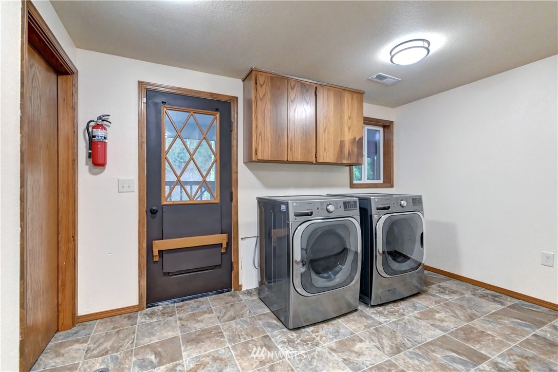 15220 OK Mill Road Snohomish, WA 98290 - Photo 17 of 26 a utility room with dryer and washer