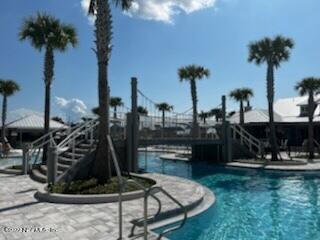 62 Thurnham Lane St. Augustine, FL 32092 - Photo 13 of 18 a view of swimming pool with a table and chairs