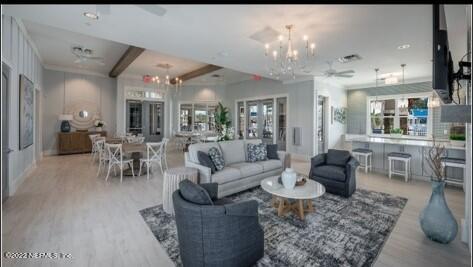 62 Thurnham Lane St. Augustine, FL 32092 - Photo 17 of 18 a living room with furniture and a chandelier