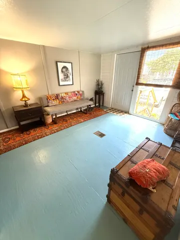 a bedroom with bed and window