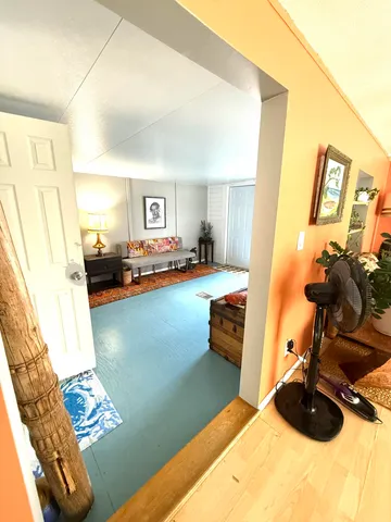 a view of a living room and dining room