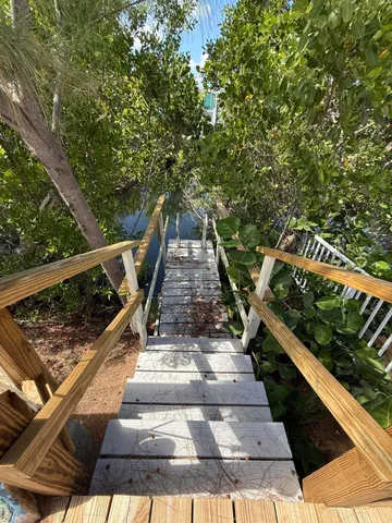a view of balcony with deck and trees