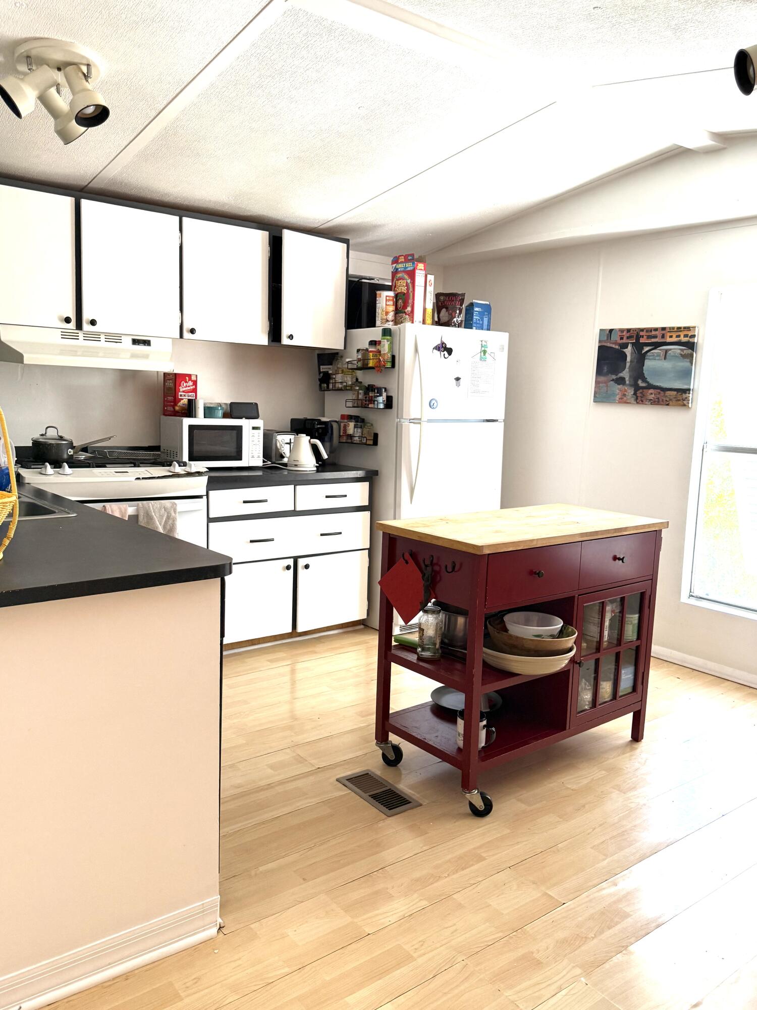 27960 Porgie Path Summerland Key, FL 33042 - Photo 21 of 30 a kitchen with stainless steel appliances granite countertop a stove a sink and a refrigerator