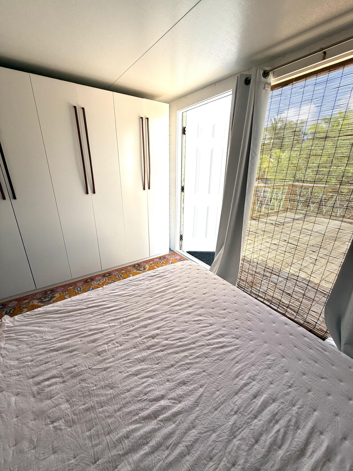 27960 Porgie Path Summerland Key, FL 33042 - Photo 26 of 30 a bedroom with a bed and a window