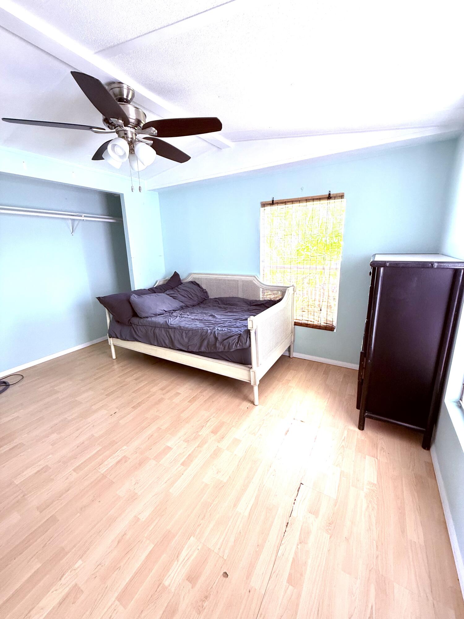 27960 Porgie Path Summerland Key, FL 33042 - Photo 27 of 30 a living room with a bed furniture and a window