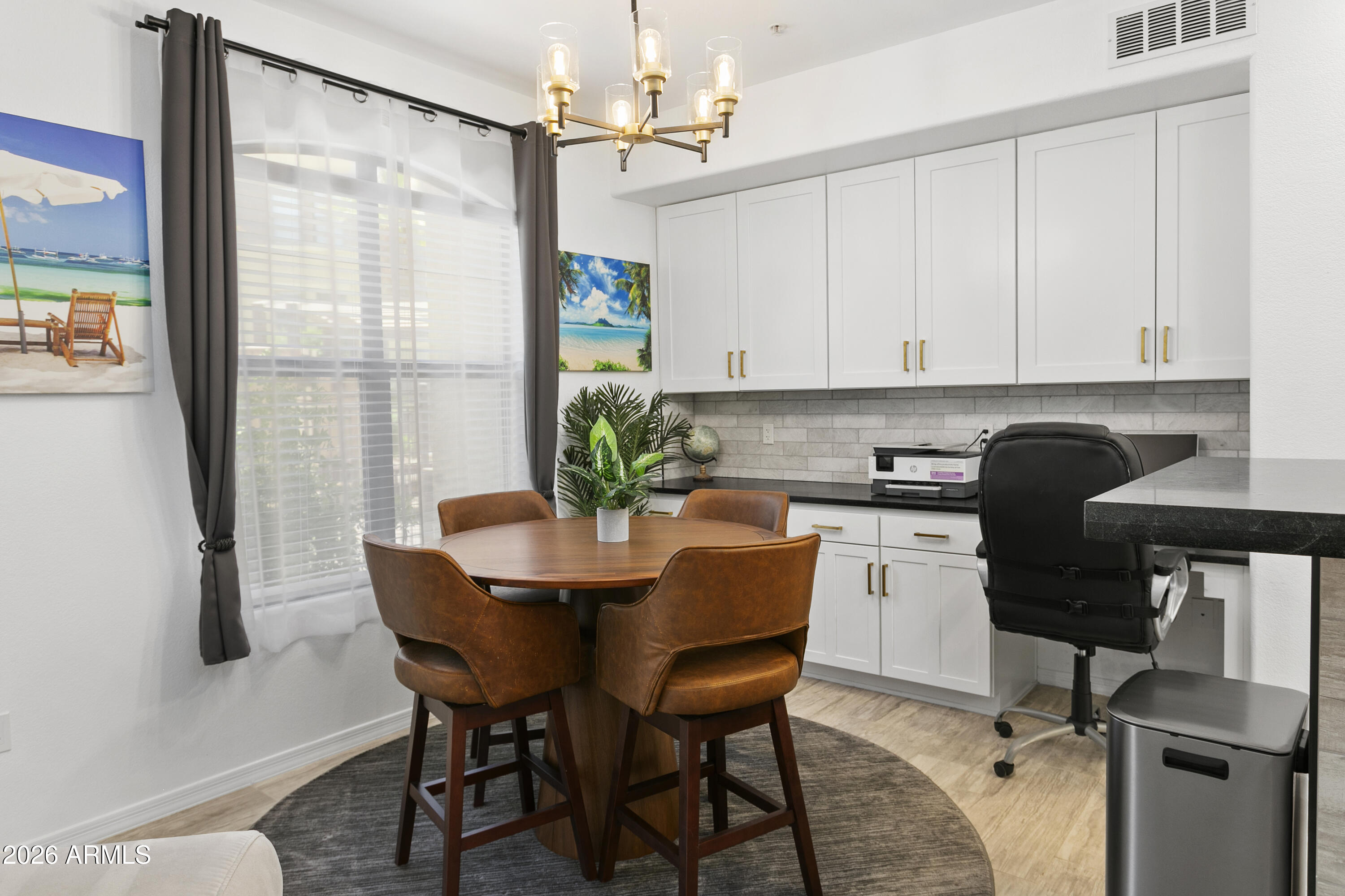 7601 East Indian Bend Road, Unit 1017 Scottsdale, AZ 85250 - Photo 7 of 49 a view of a dining room with furniture and a chandelier