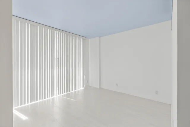 a view of wooden floor and entryway