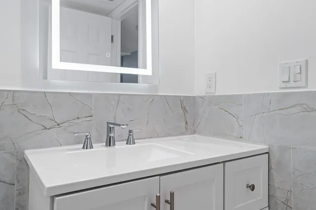 a view of staircase with white walls