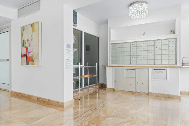 a room with furniture a flat screen tv and a window