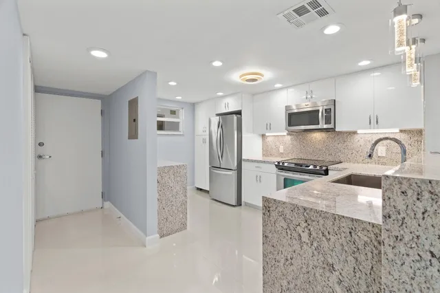 a view of room with window and cabinet