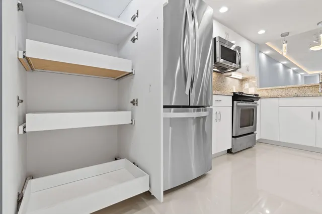 a kitchen with a stove and a microwave