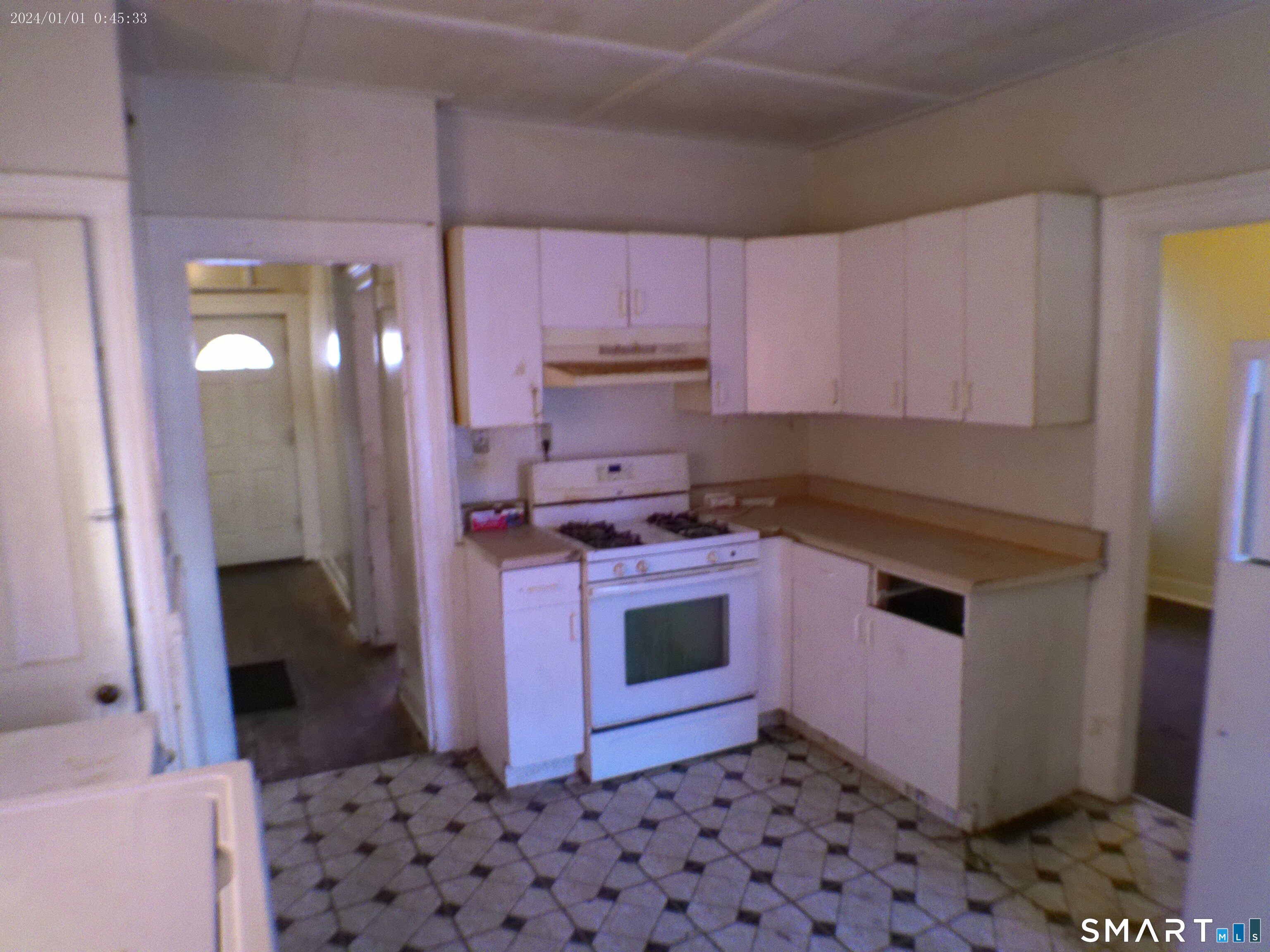 306 Carroll Avenue Bridgeport, CT 06607 - Photo 11 of 15 a kitchen with stainless steel appliances a stove a microwave a sink and cabinets