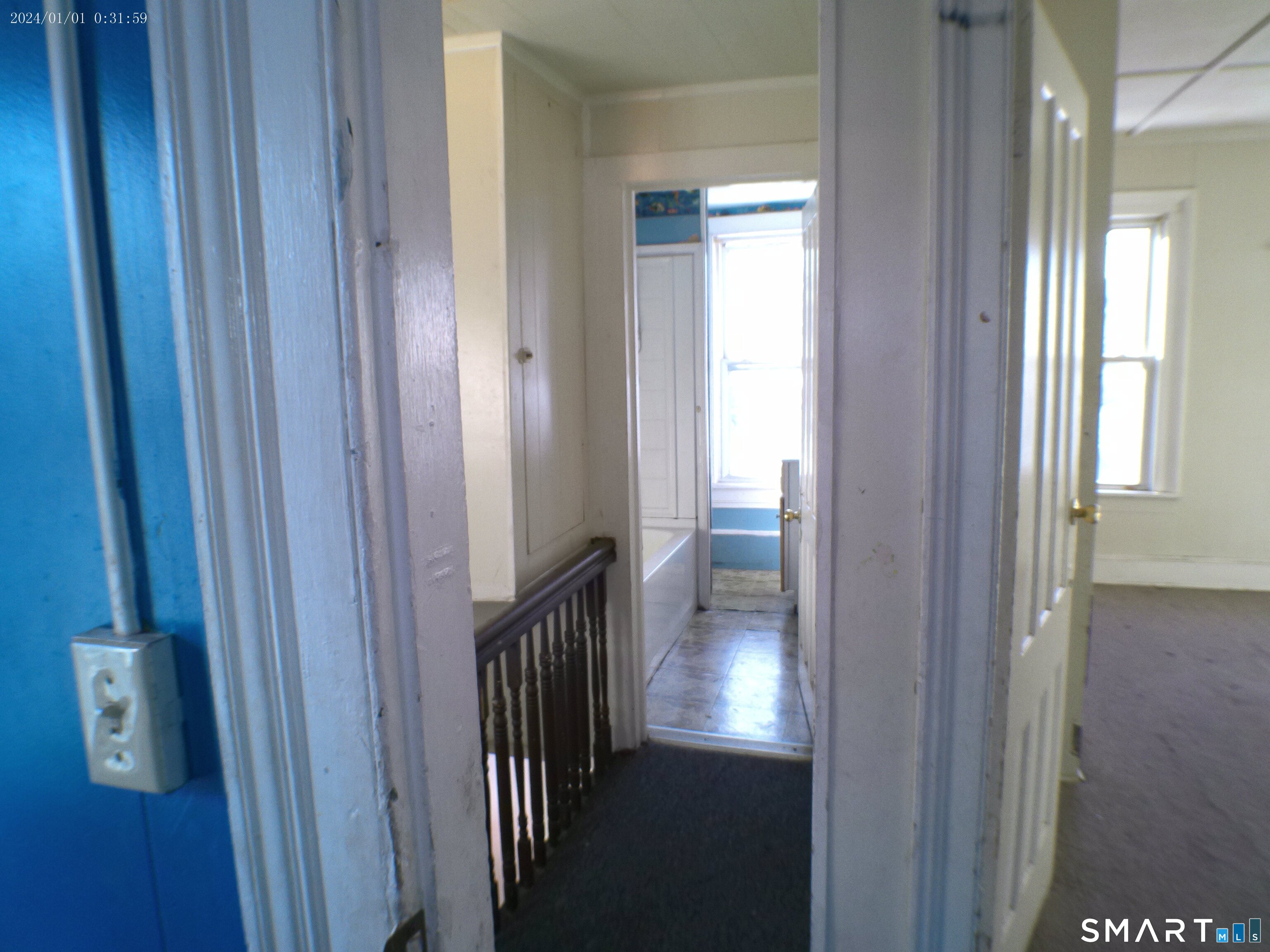 306 Carroll Avenue Bridgeport, CT 06607 - Photo 15 of 15 a view of a hallway with a door