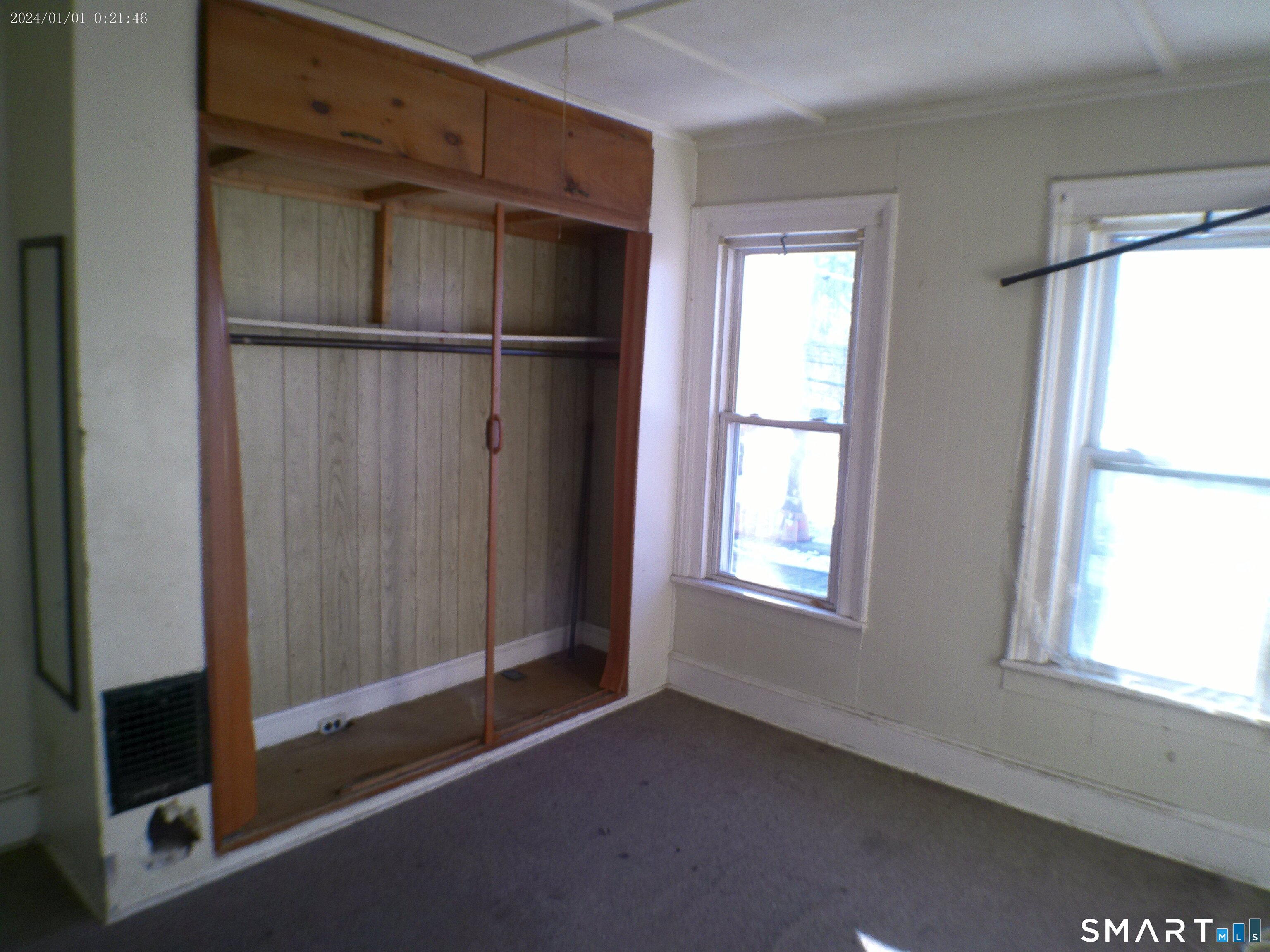 306 Carroll Avenue Bridgeport, CT 06607 - Photo 6 of 15 an empty room with windows and closet
