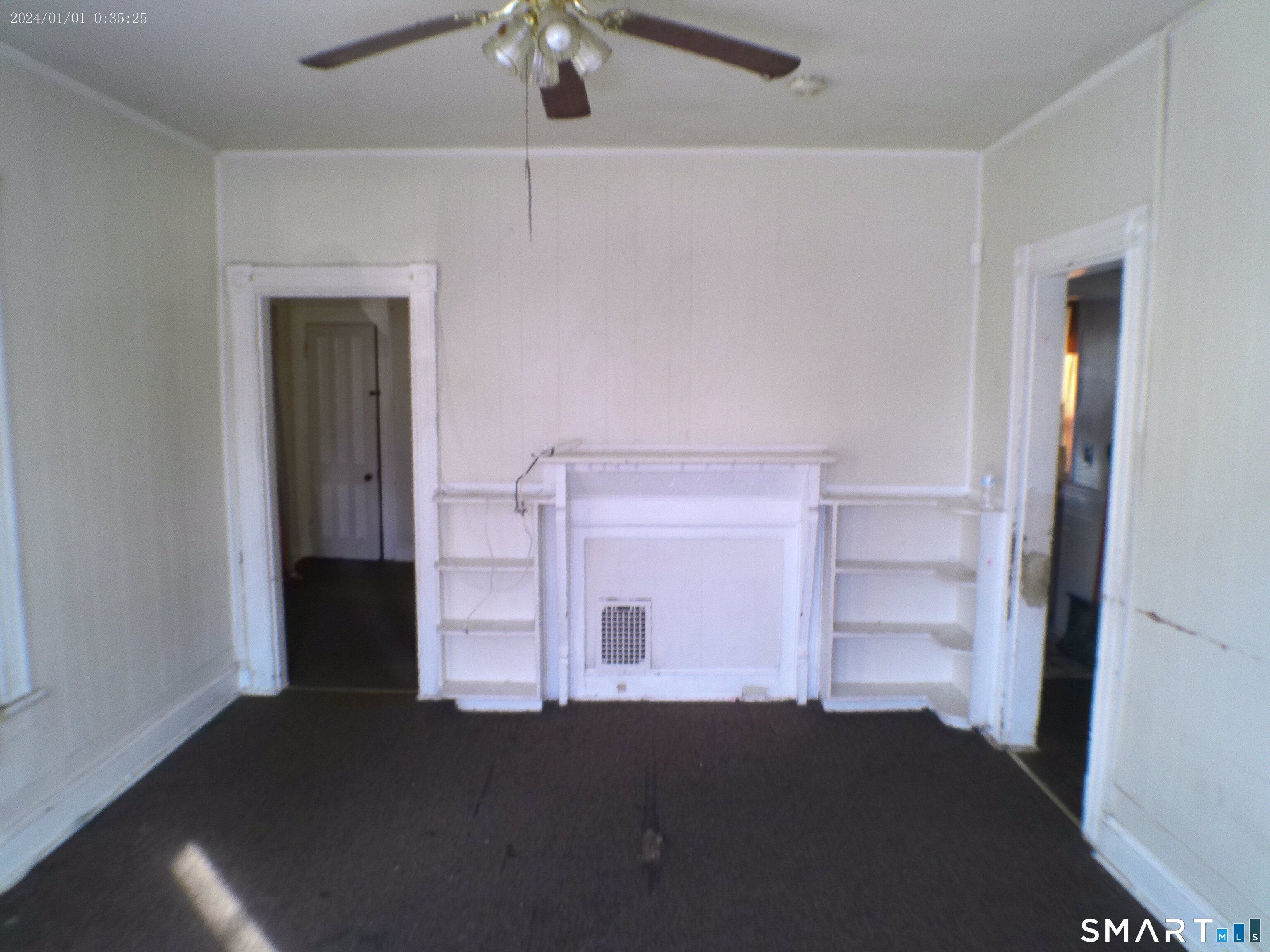 306 Carroll Avenue Bridgeport, CT 06607 - Photo 9 of 15 a view of a bedroom with a furniture and ceiling fan