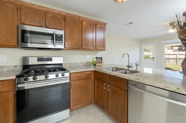 a kitchen with a stove and a sink