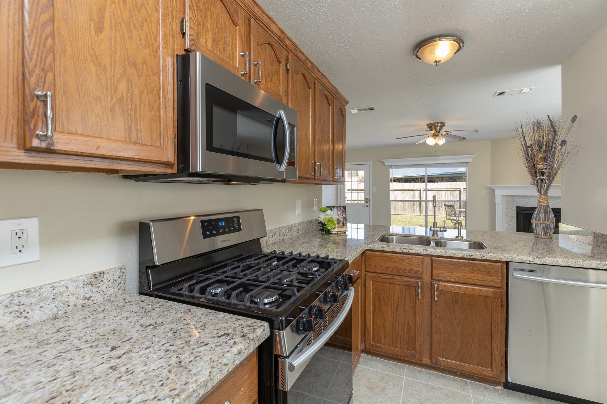 3422 Keygate Drive Spring, TX 77388 - Photo 13 of 32 a kitchen with a stove and a sink